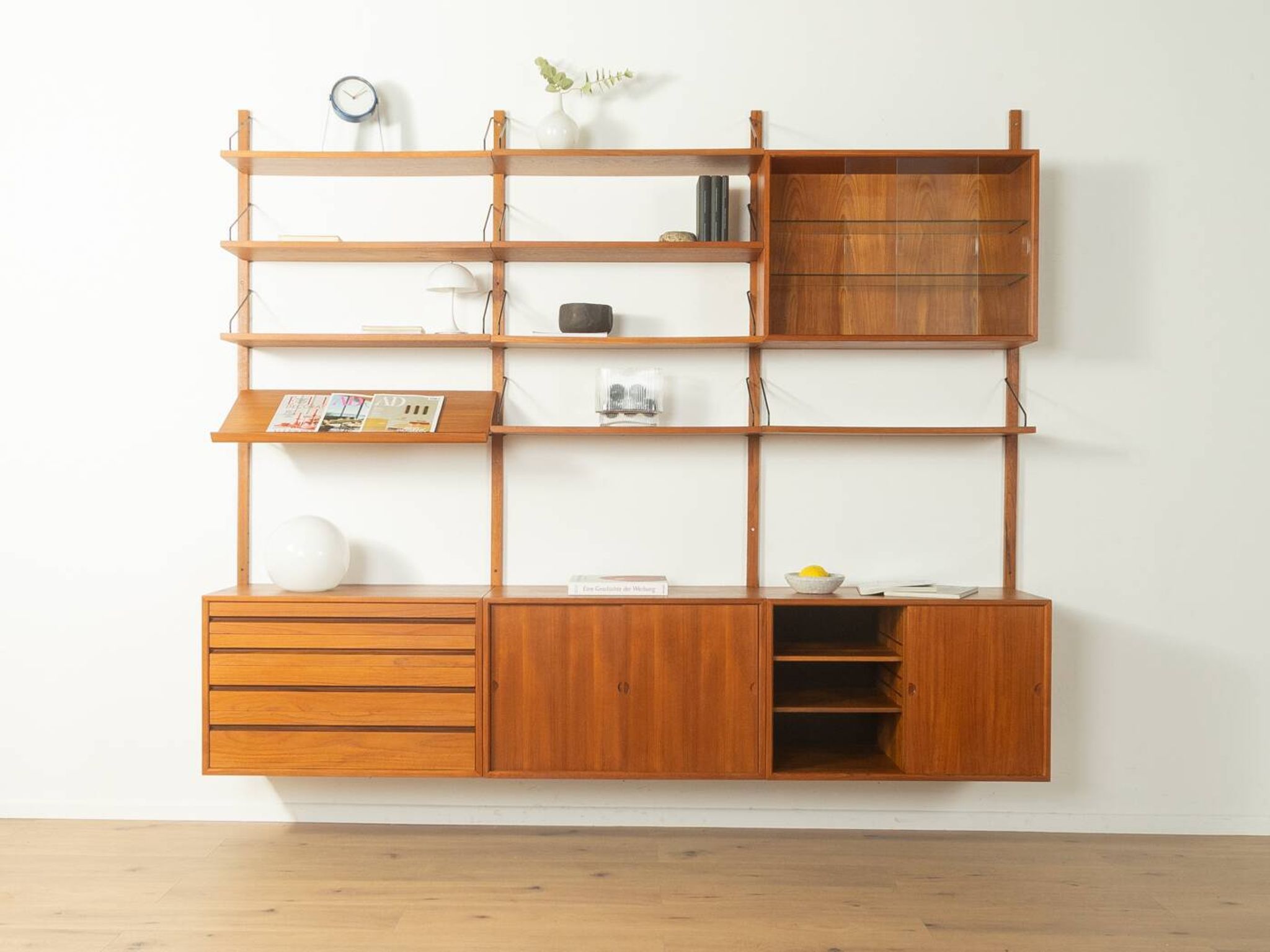 Classic shelving system from the 1960s in teak veneer by Poul Cadovius for Cado