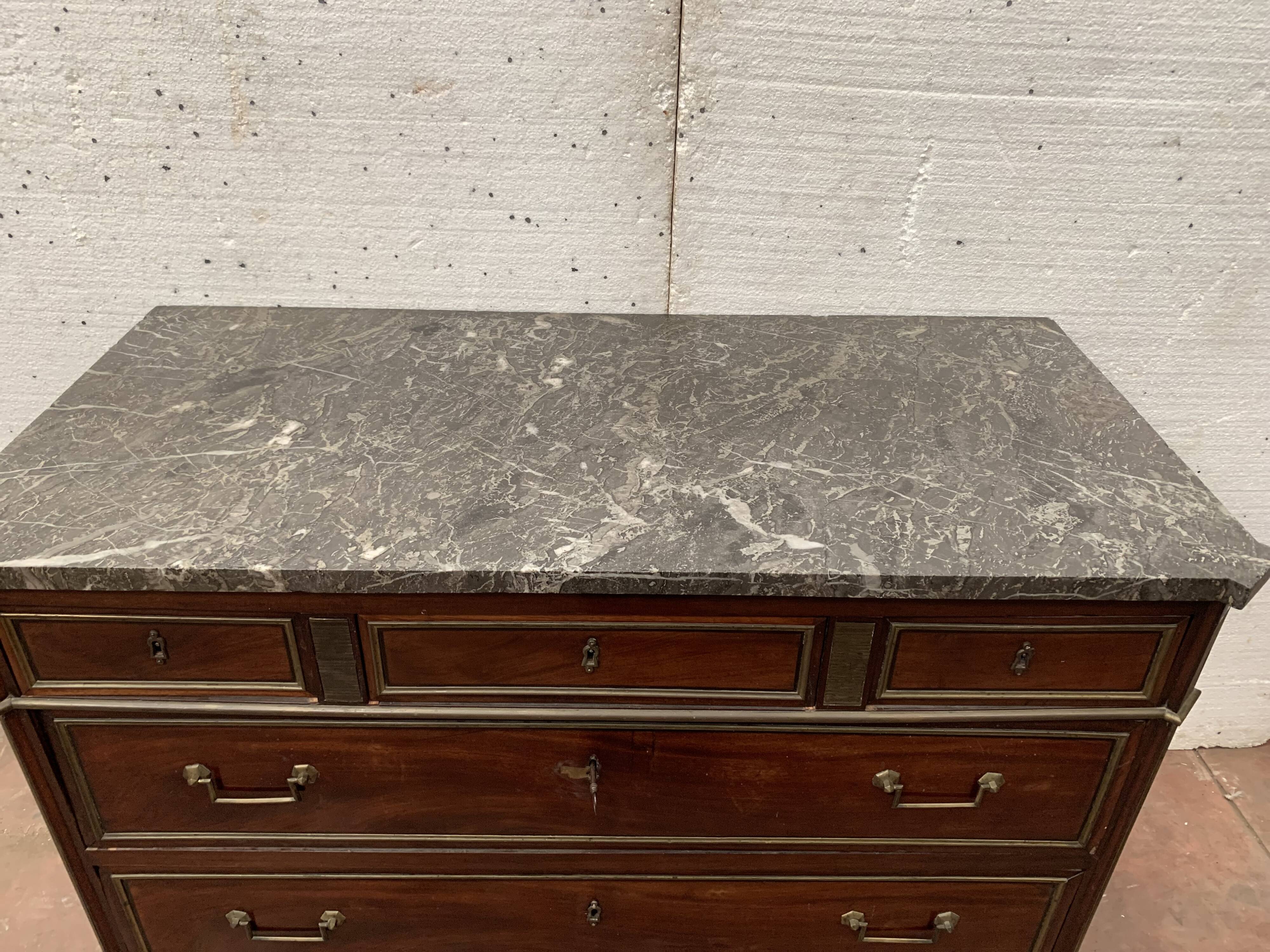 Commode style Lois XVI in mahogany Top of veined gray marble XIX century