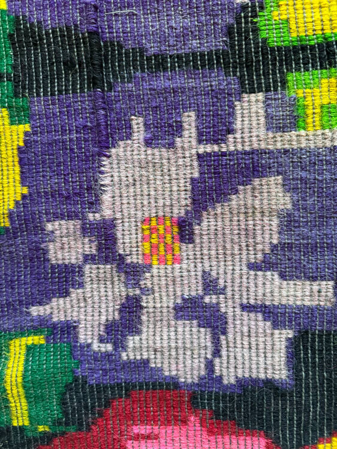 Bohemian floral design, handwoven wool rug, black background with colorful flowers