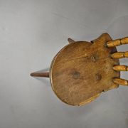 Old farmers tripod chair for decorative use