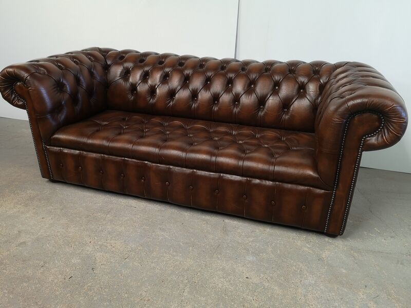 Light brown leather chesterfield sofa upholstered