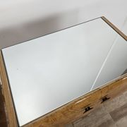 Pair of maple bedside tables from the 1950s with mirrored tops.
