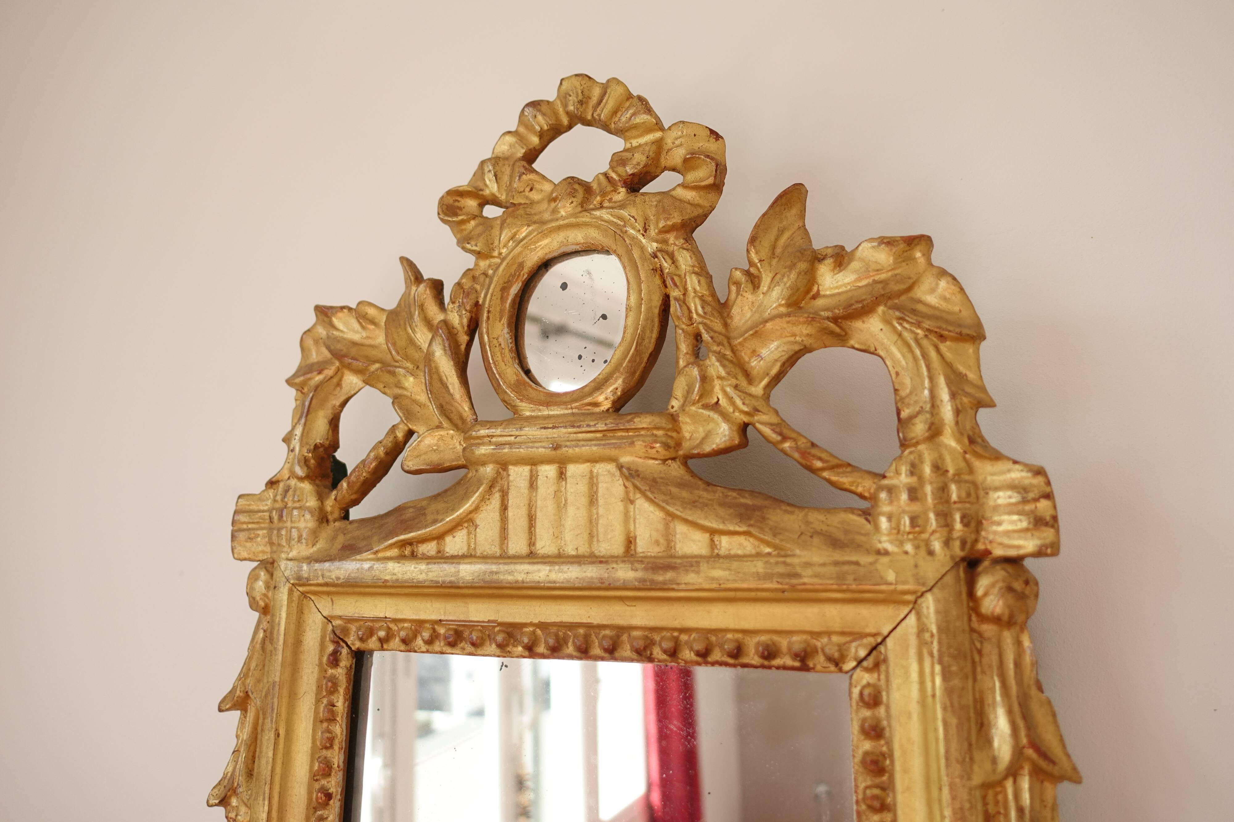 Miroir Louis XVI en bois doré 35x 65cm