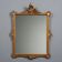 Antique Rococo-style mirror in carved gilded wood, 20th century.