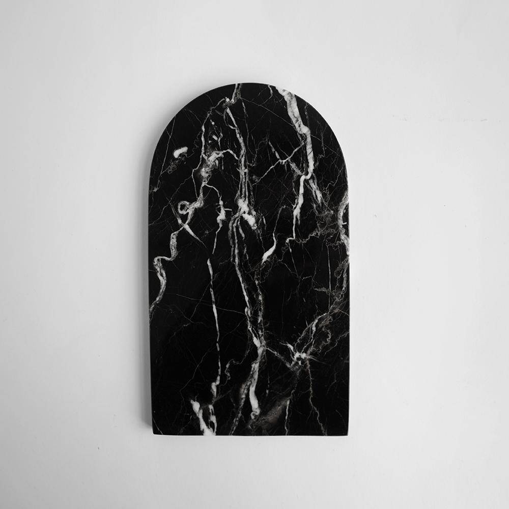 Small curved black marble plate