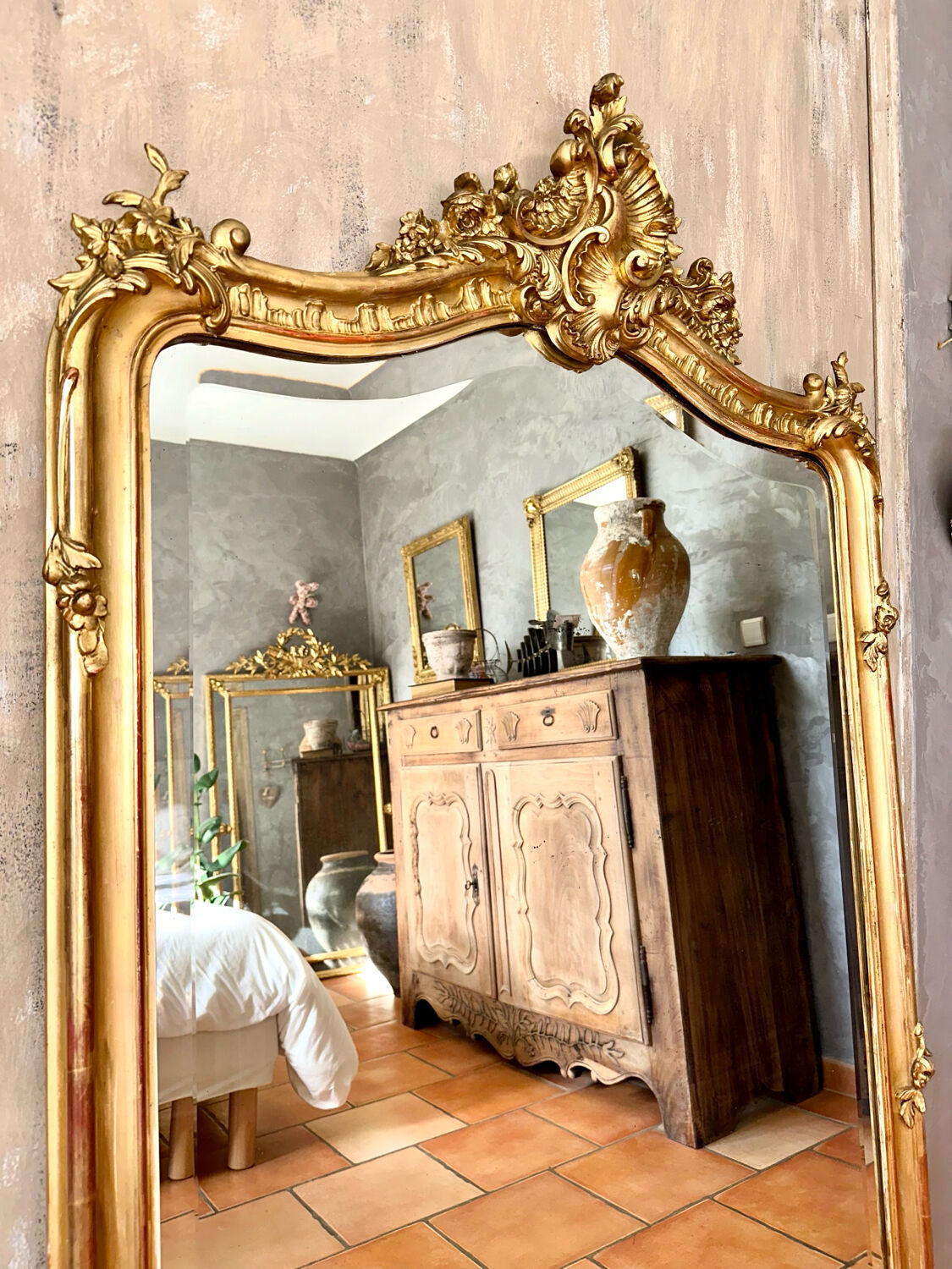 Antique gilded mirror with Louis XV pediment