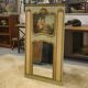 Trumeau mirror with cracked patina and oil on panel depicting a romantic scene from the 19th century.