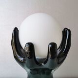 Italian design ceramic table lamp, two hands and glass shade.
