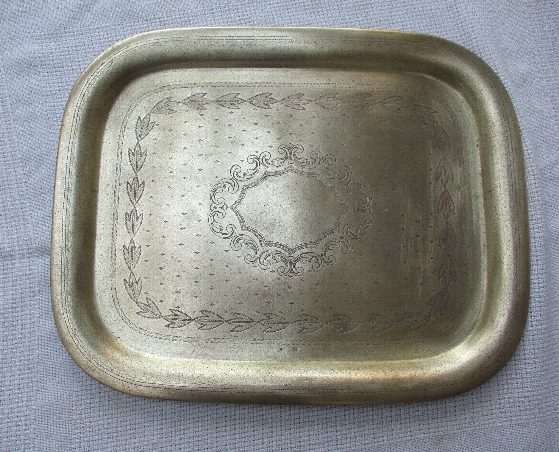 Rectangular brass top with engraved decoration