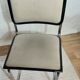 Cesca B32 chair by Marcel Breuer, upholstered in beige fabric.