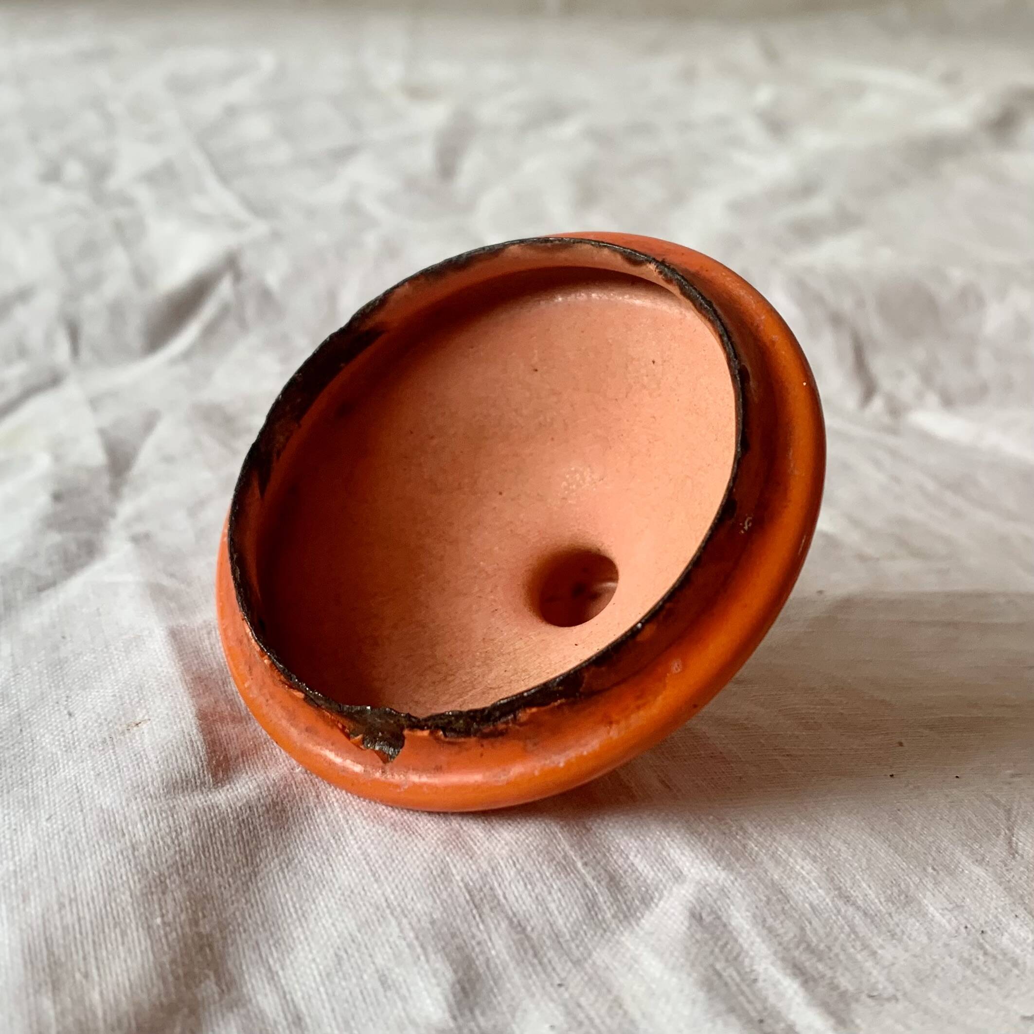 Vintage orange enameled sheet metal kettle