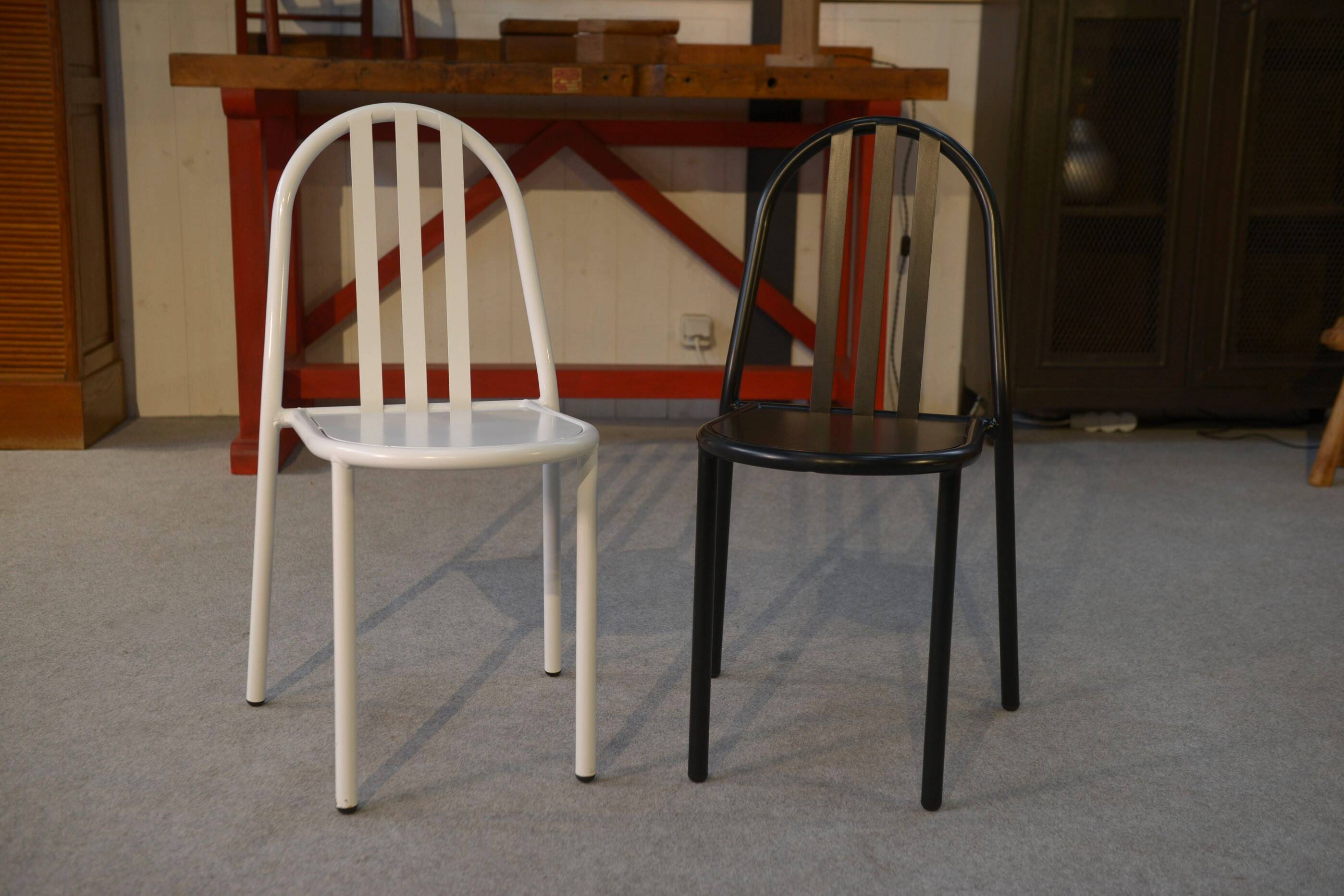 Pair of white and black chairs by Mallet Stevens