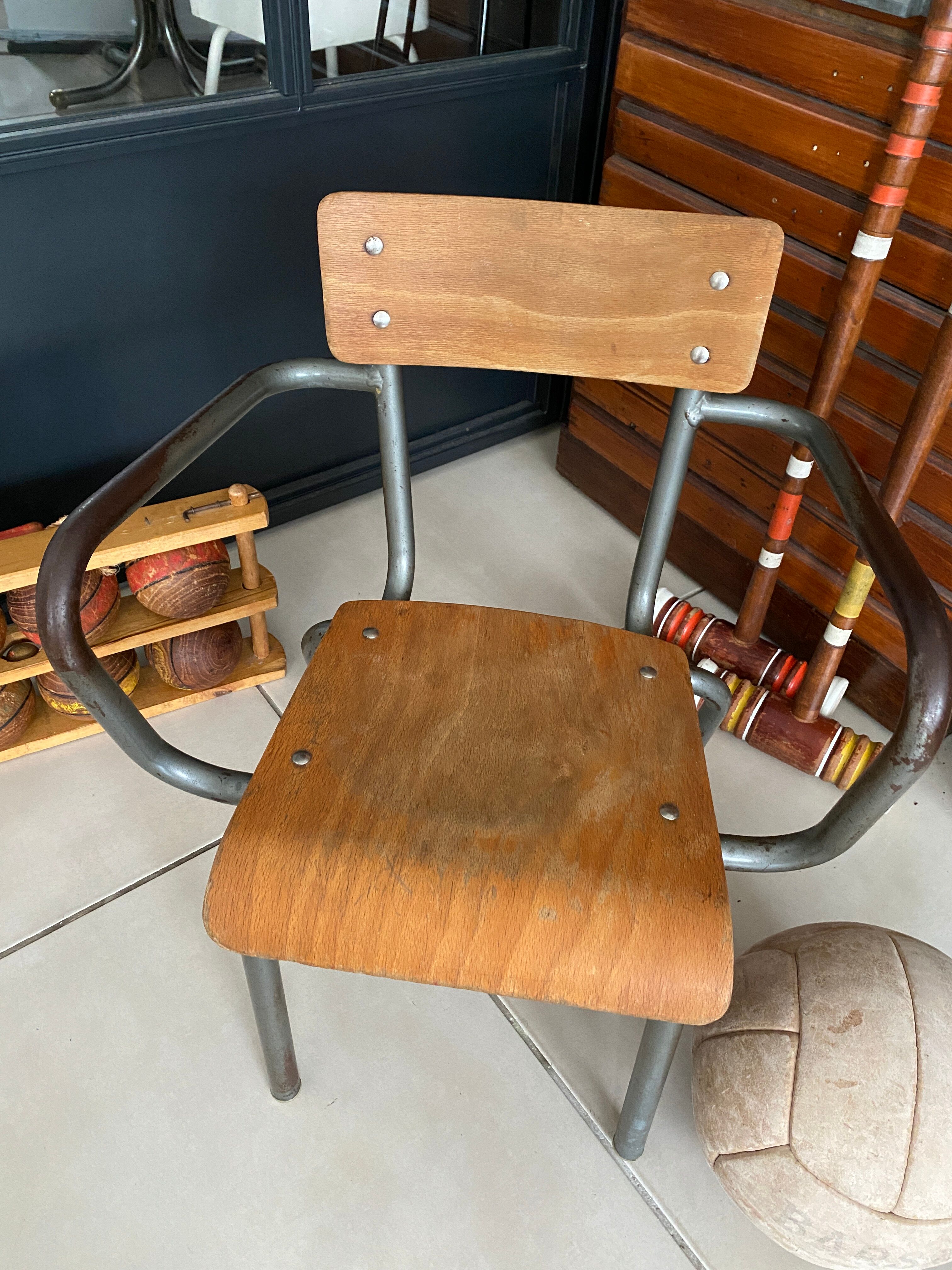 Old Mullca school chair with armrests