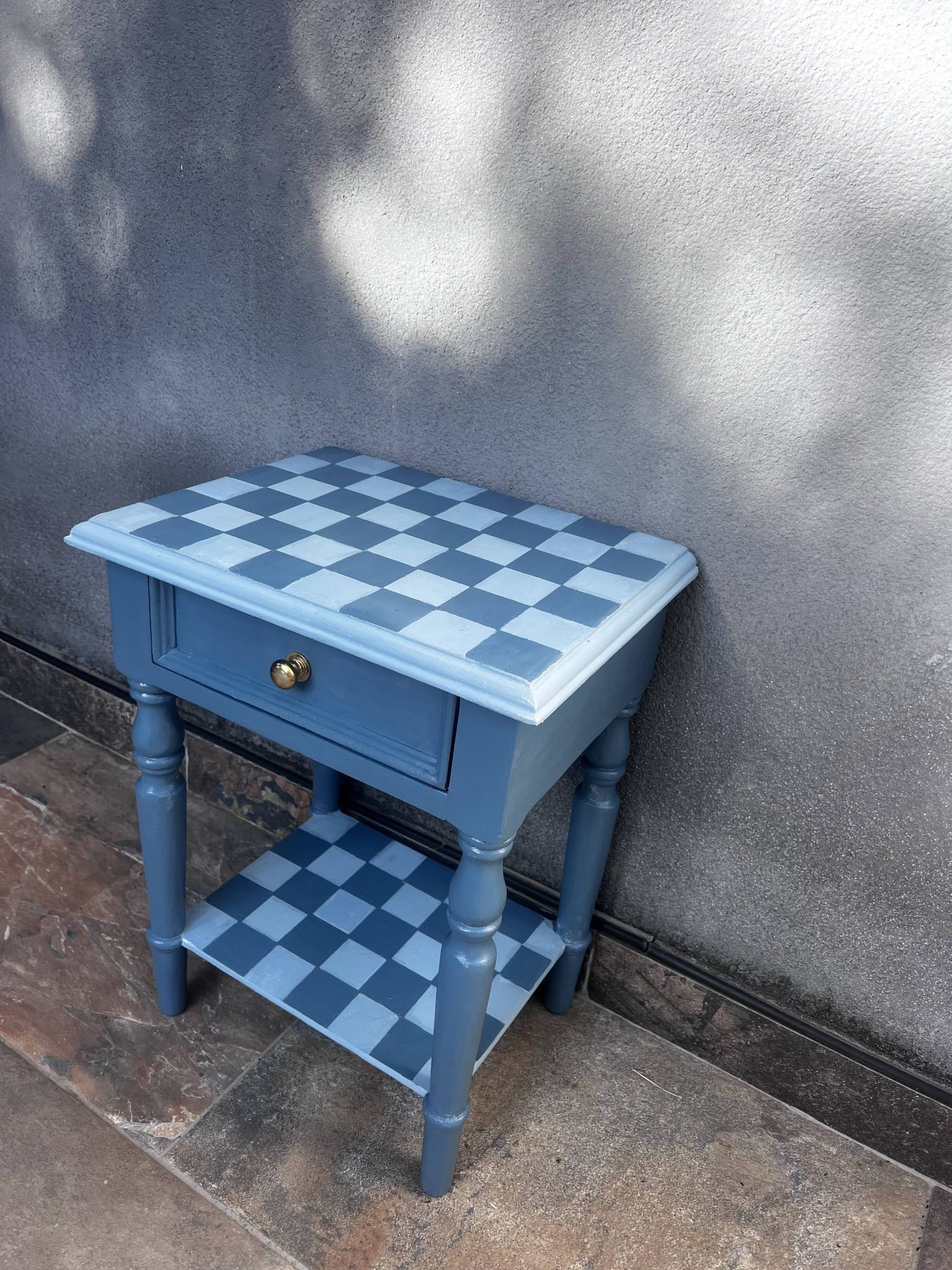 Blue checkered bedside table, neo-vintage style, turned legs.