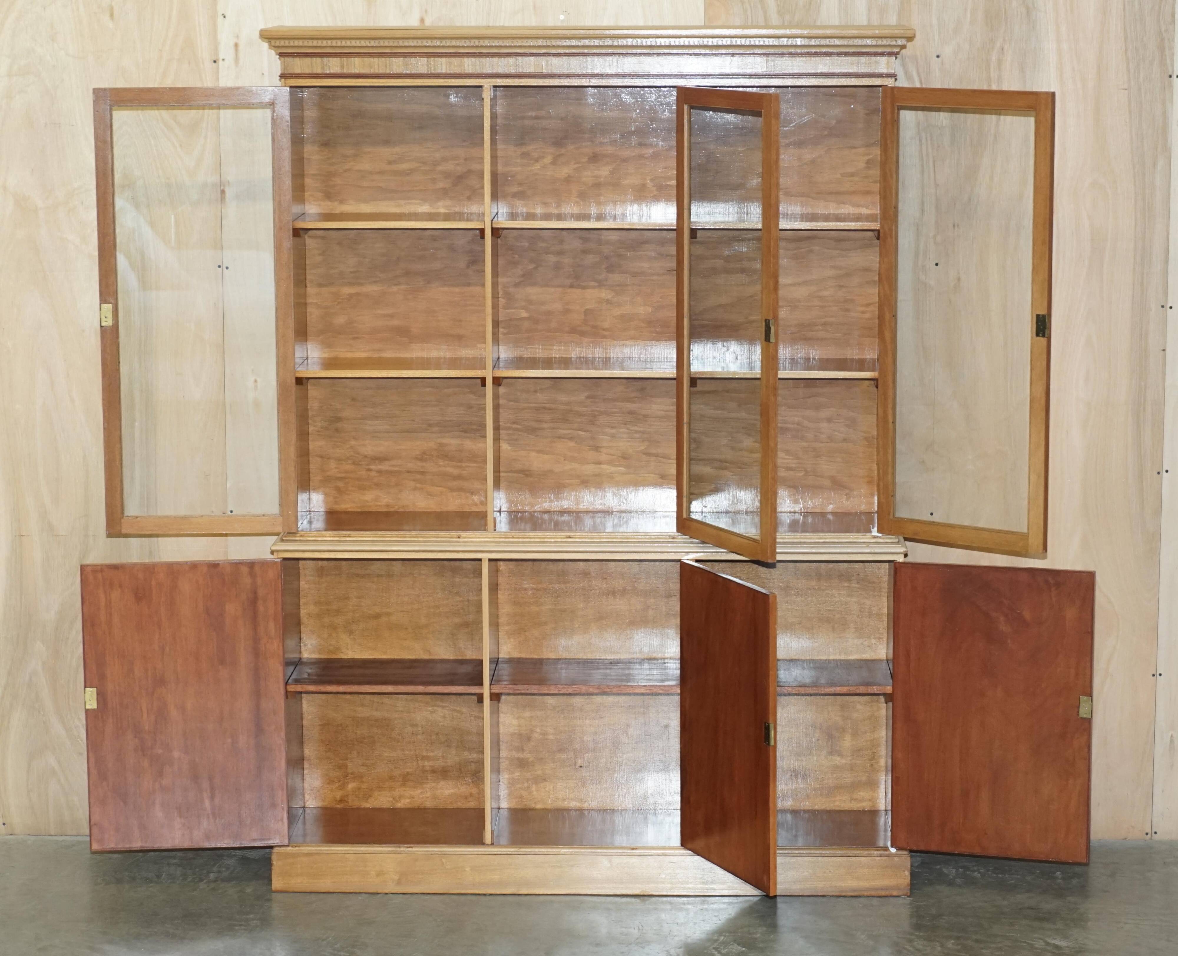 Library in the style of David Linley in satinwood, walnut, and rosewood.