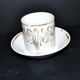 Paris porcelain coffee cup with floral design, antique porcelain with gold trim.