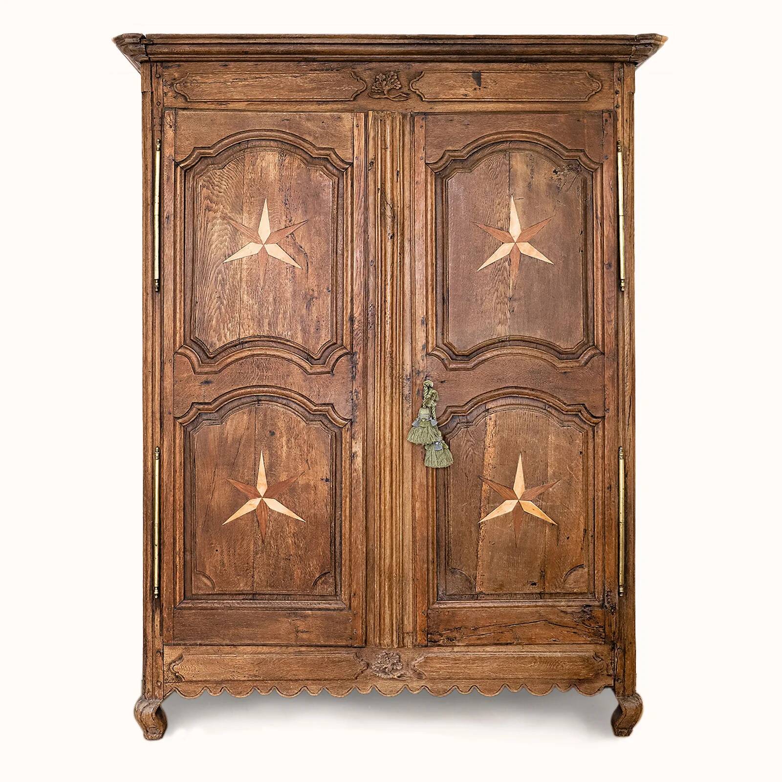 Antique French rustic wardrobe with star inlays.