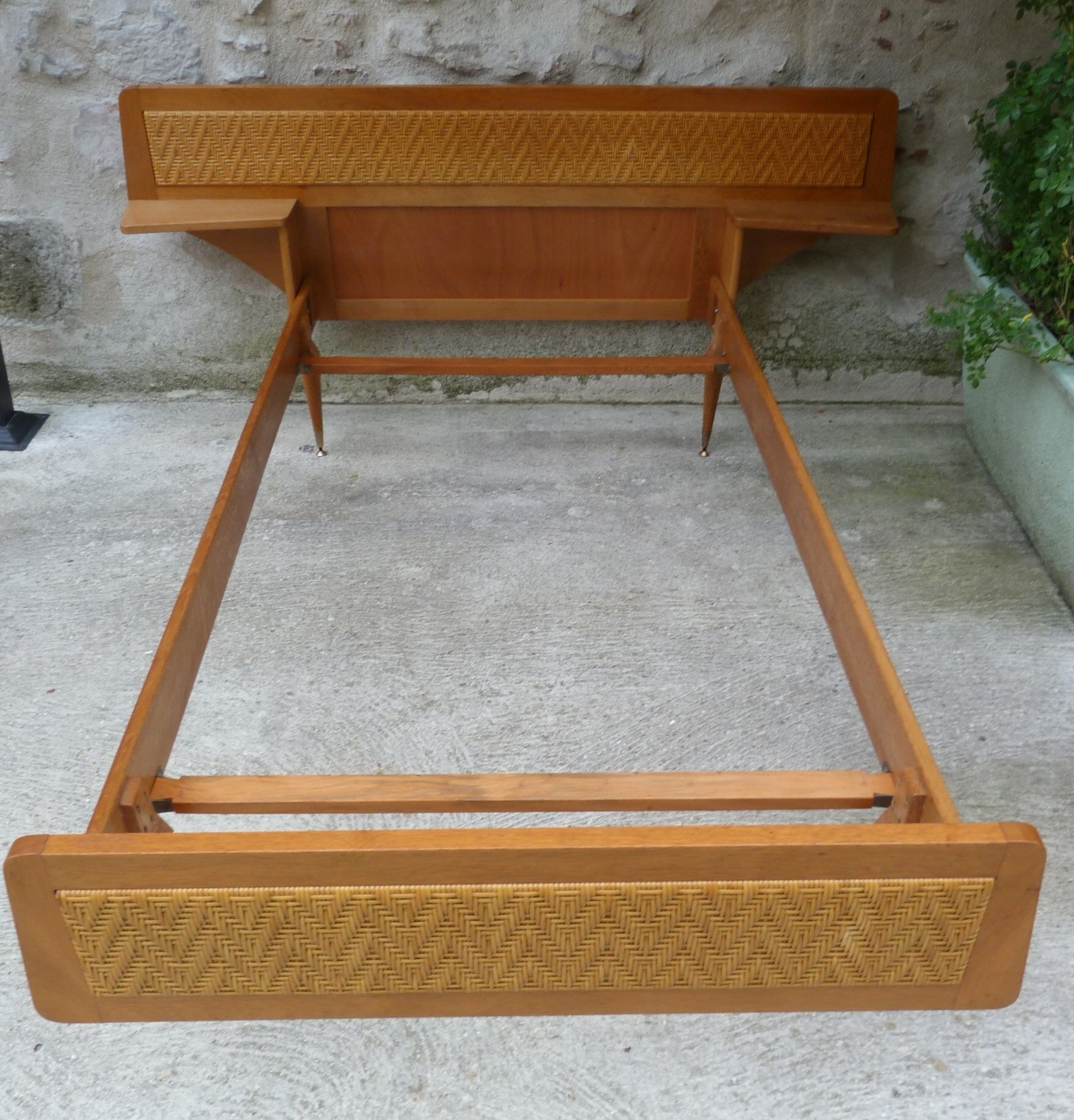 Wooden bed and rattan