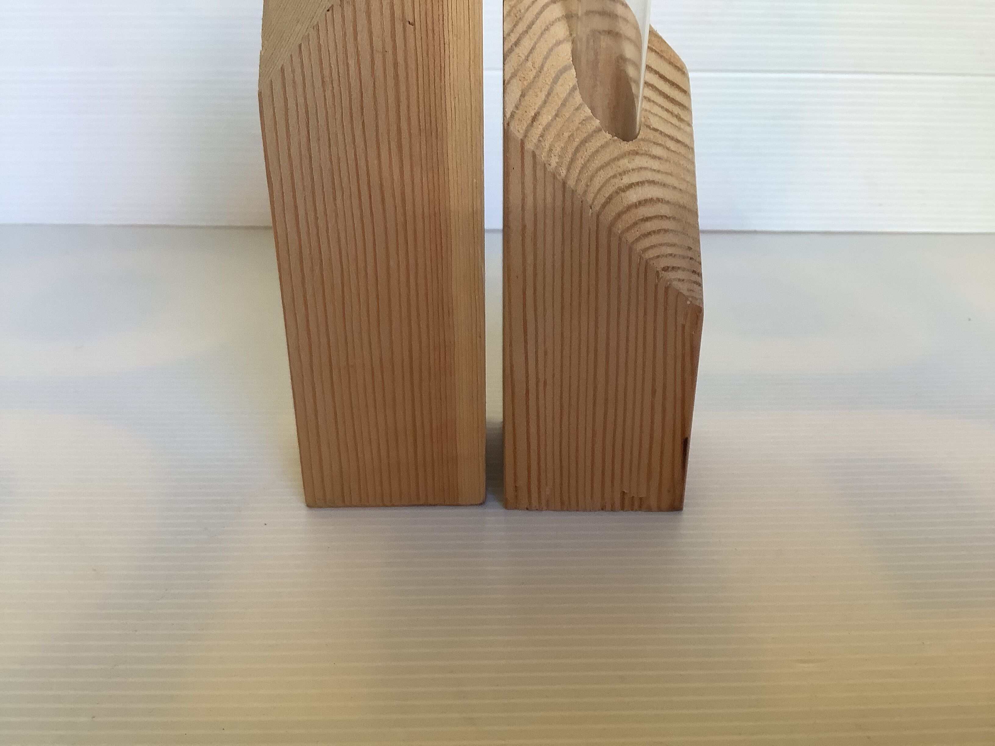 Pair of diamond-shaped wooden Scandinavian test tube vases.