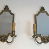Pair of mirror and bronze wall lamps with lions' heads, french work. around 1940