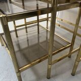 Set of three nesting tables in brass and smoked glass, 20th century