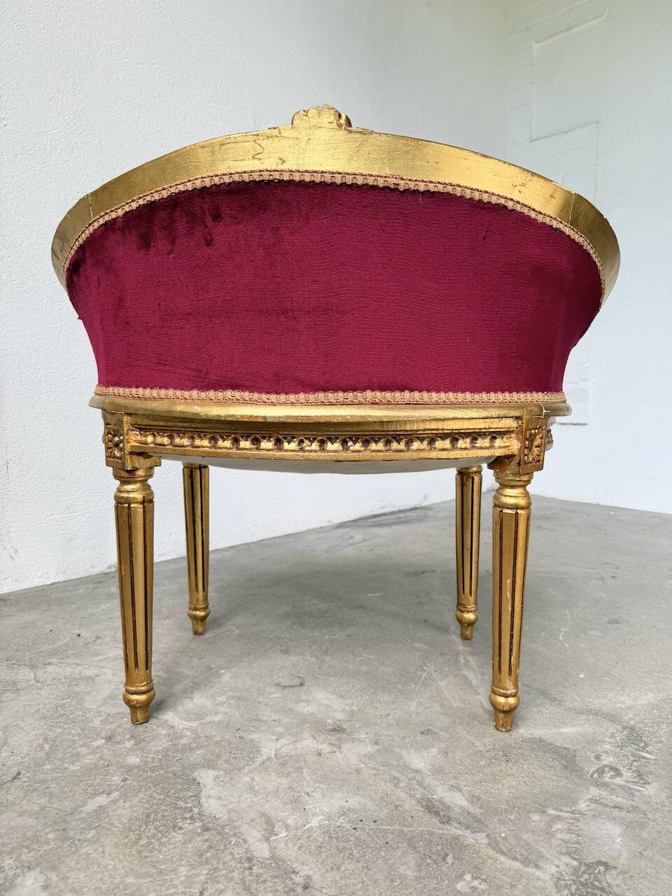 Louis XVI gilt wood and red velvet armchair