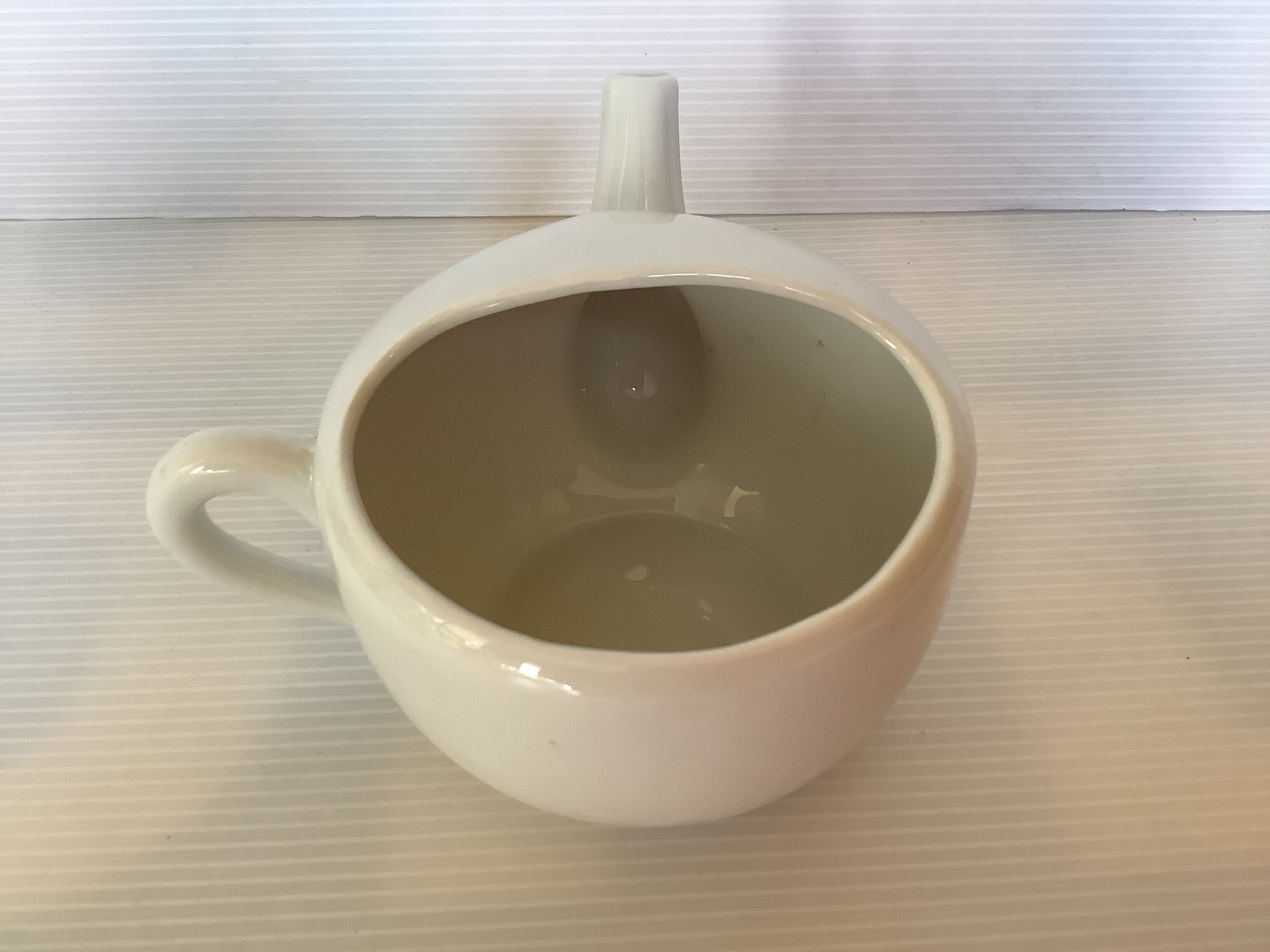 Old baby bottle sauceboat