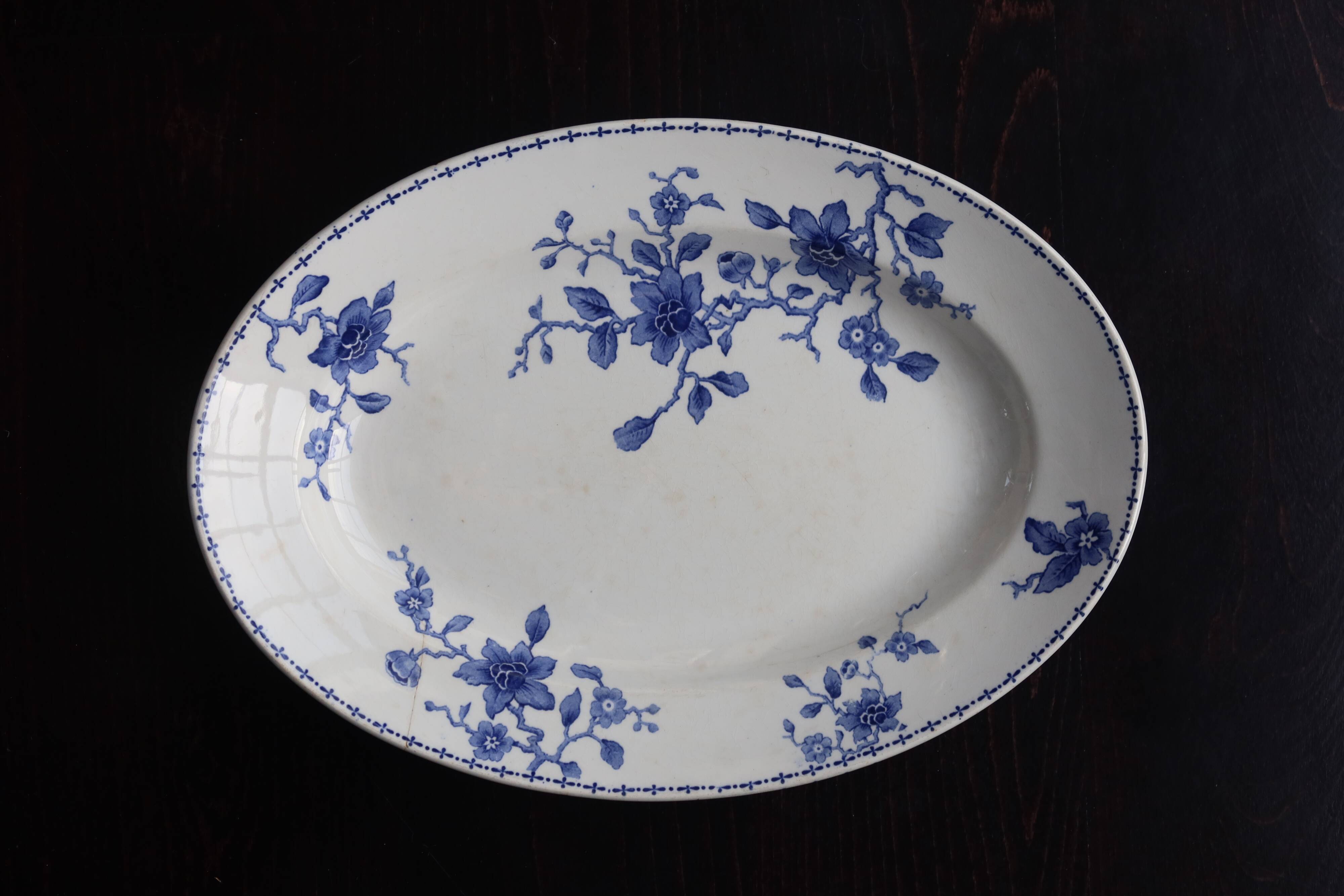 Antique serving dish in white and blue earthenware.