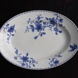 Antique serving dish in white and blue earthenware.