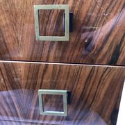 Lacquered 3-drawer chest with rosewood veneer.