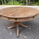 Round extendable dining table Regency central leg stripped mahogany 1960