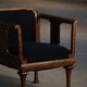 Early 20th century Danish Art Nouveau armchair, reupholstered in charcoal boucle.