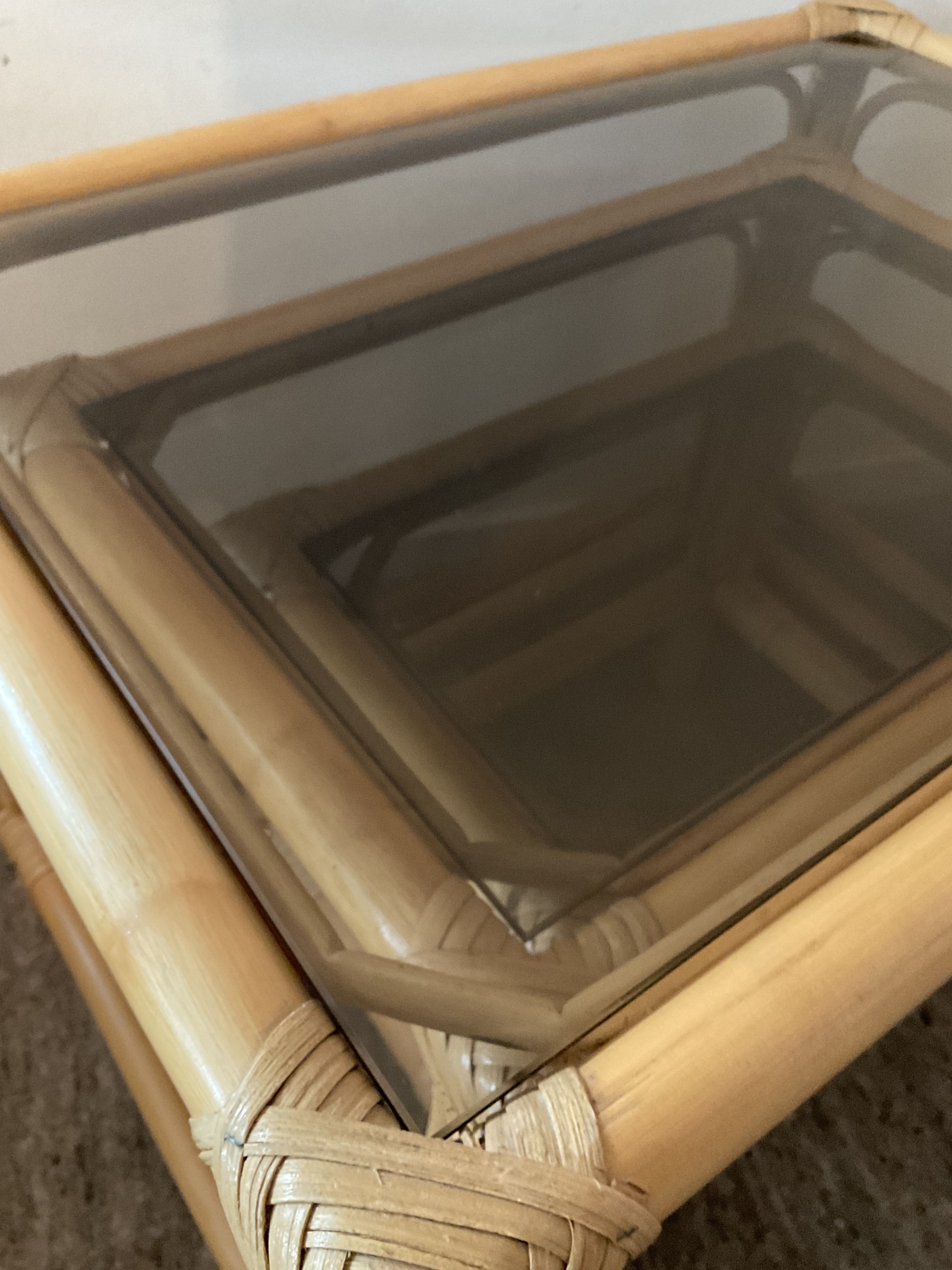 Trio of vintage pull-out tables in rattan and smoked glass 70s