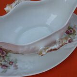 Sauce boat on dormant white porcelain, floral decoration