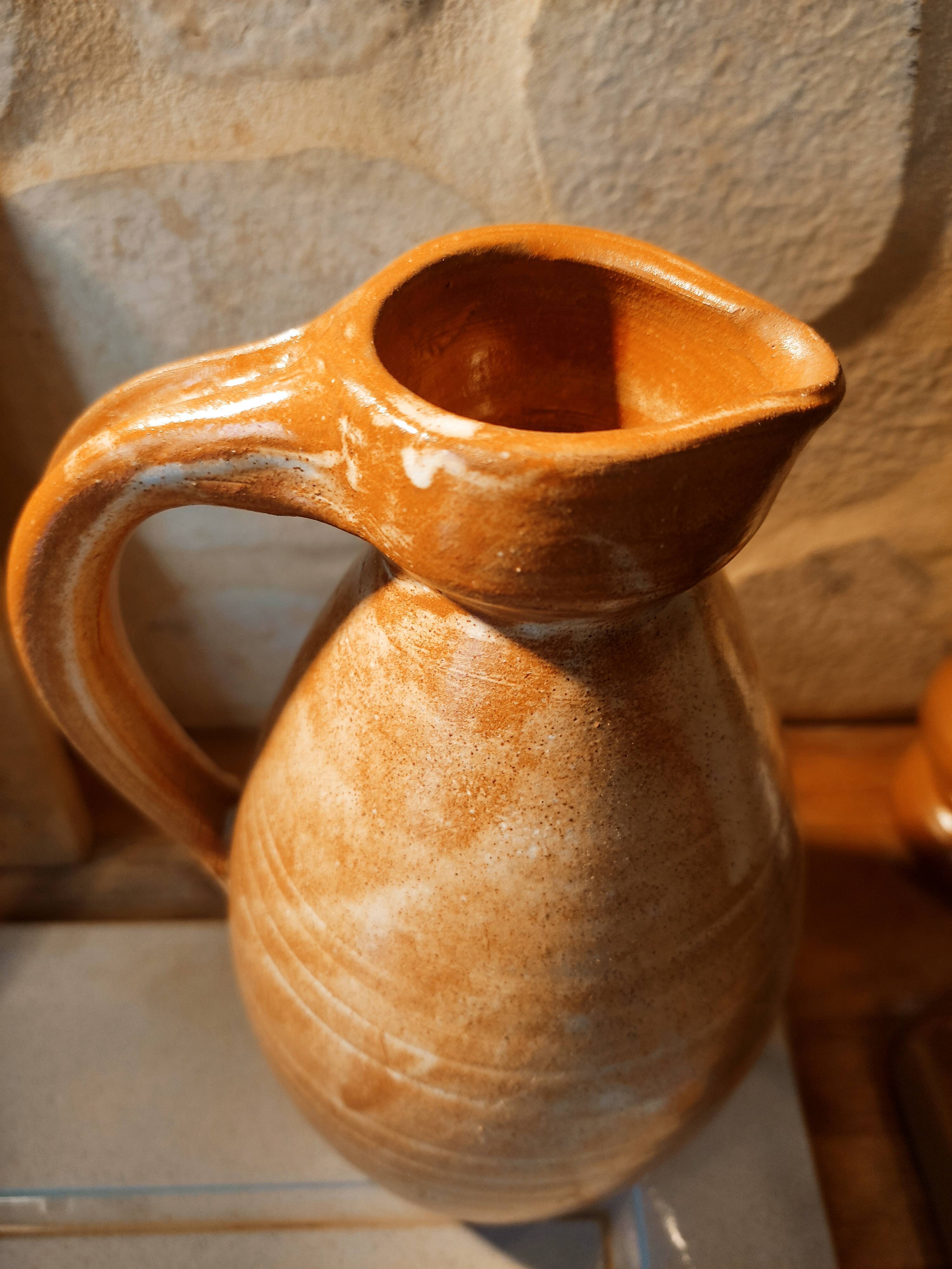 Duo of pitchers water, wine