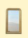 Large antique French gilded mirror with painted floral decoration.