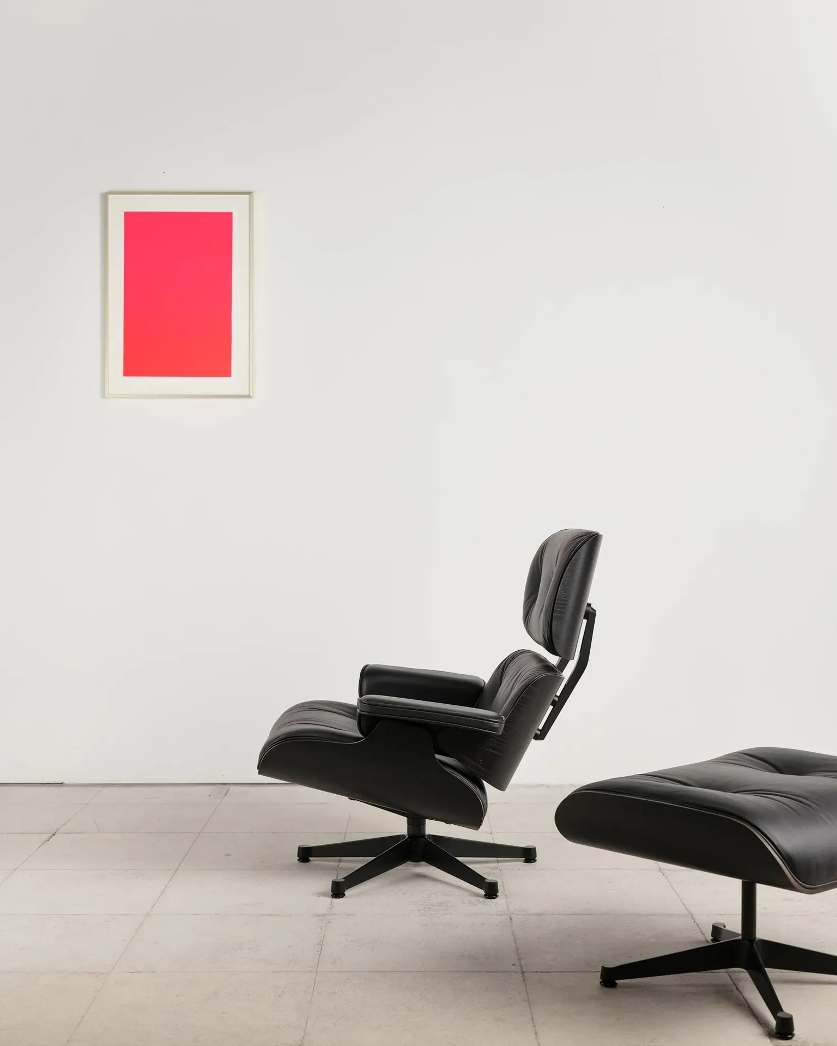 Lounge Chair and ottoman in black leather by Charles & Ray Eames, Vitra