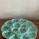 Flat oyster service and 6 splash plates of Gien green celadon