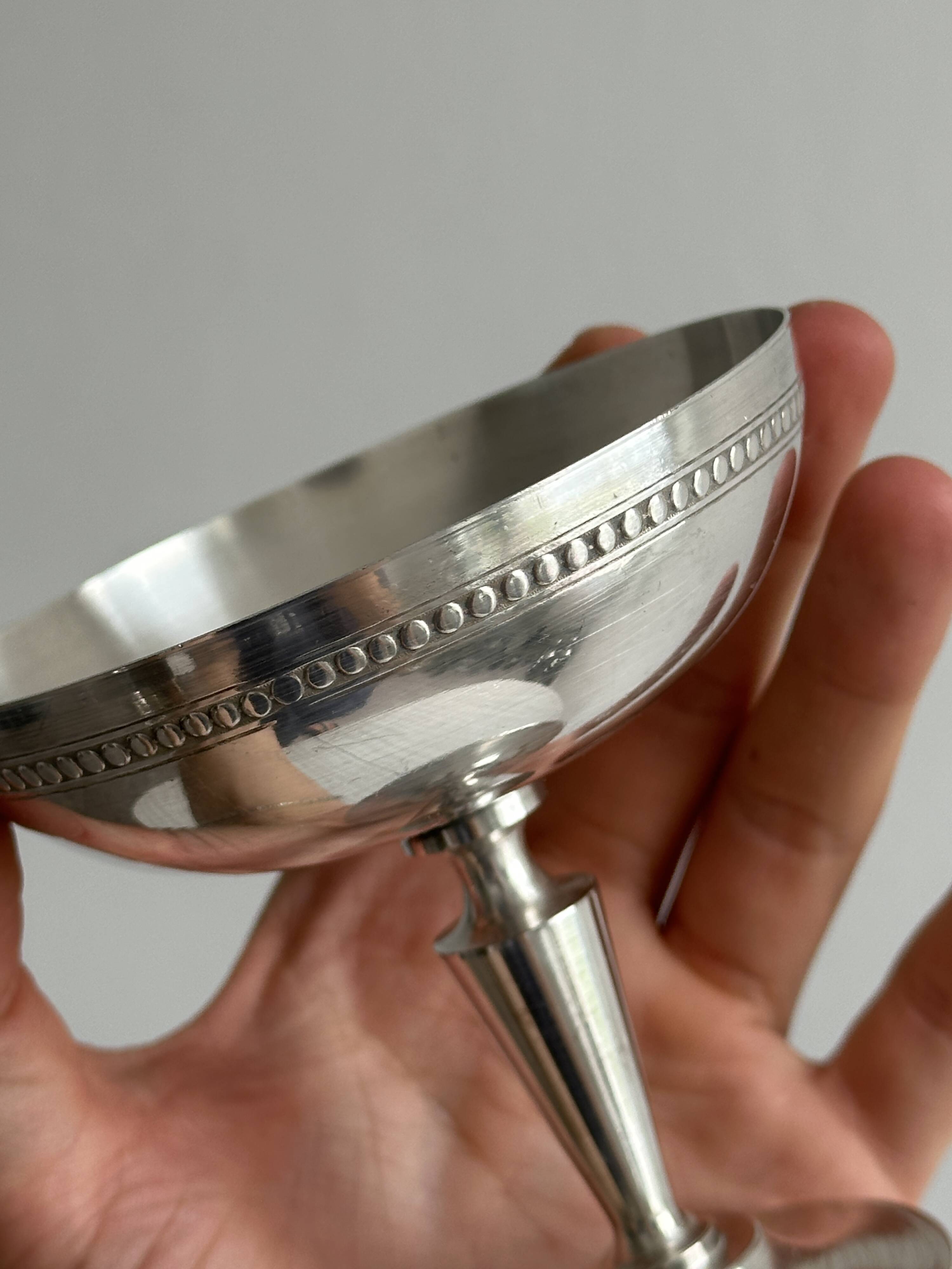 Silver-plated metal bowl on a stand