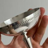 Silver-plated metal bowl on a stand