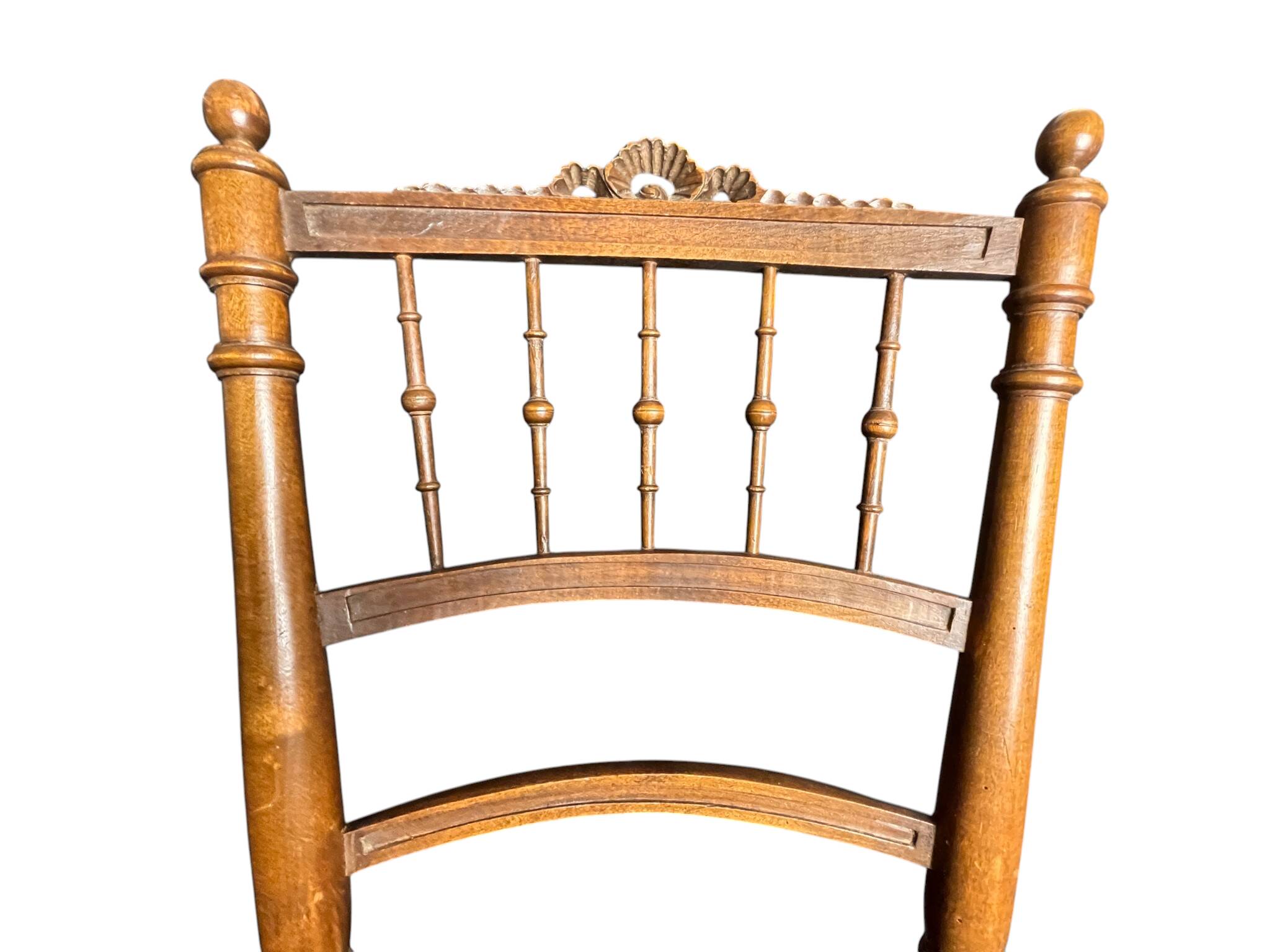 Two floral upholstered music chairs from the early 20th century.