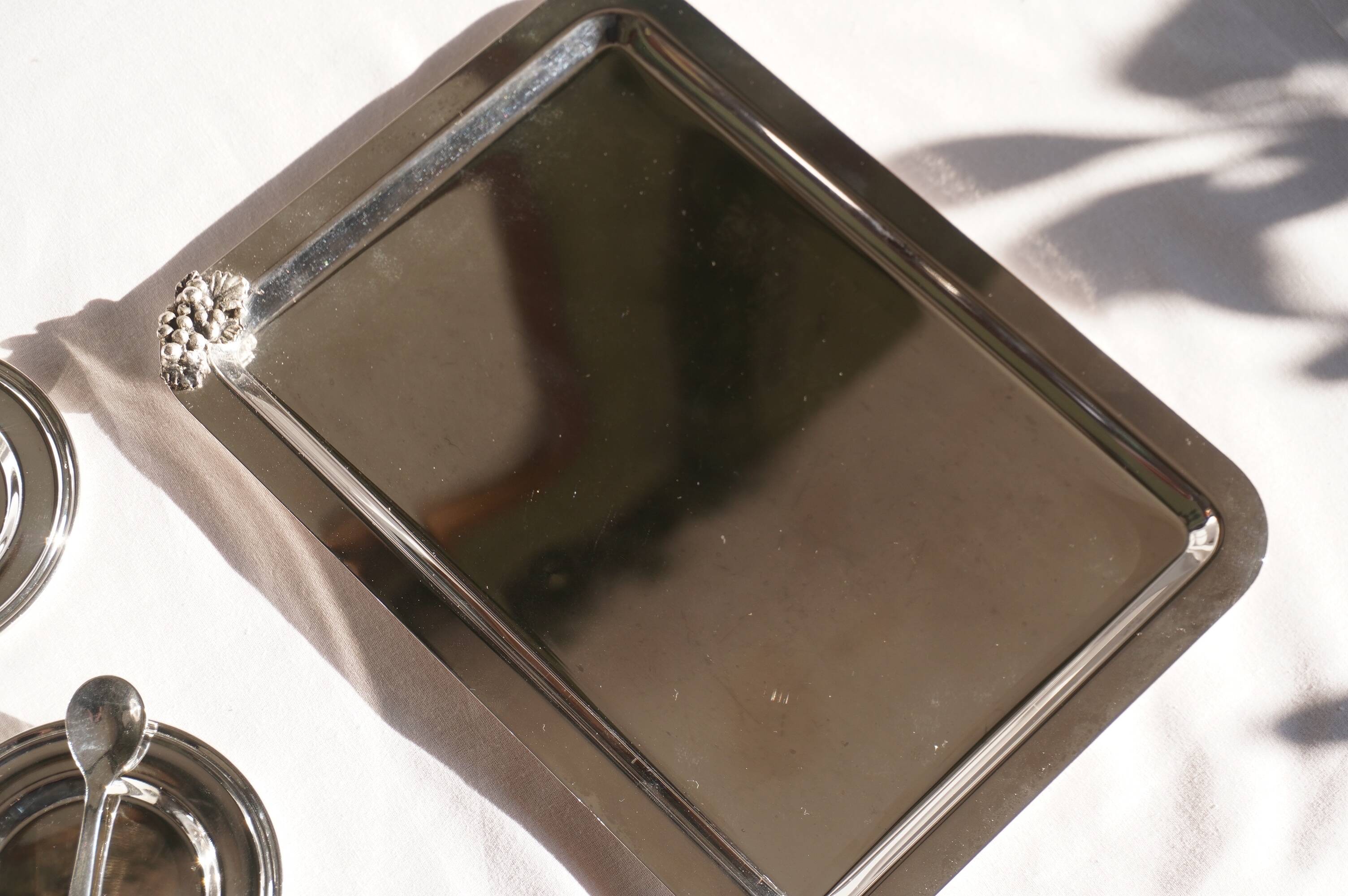 Silver-plated metal coffee service with a grape design.