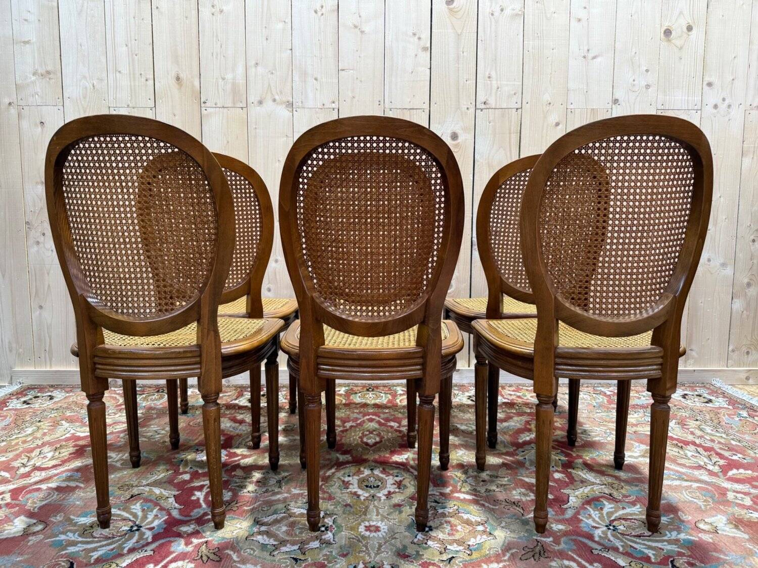 Set of 6 Louis XVI medallion chairs with caning.