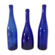 Decorative trio of old blue glass bottles