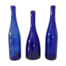 Decorative trio of old blue glass bottles