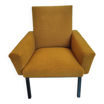 Designer armchair in cumin yellow bouclette