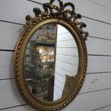 Oval mirror with gold patina