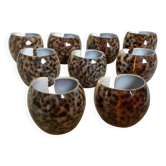 Nine knife holders made from cypraea tigris shells