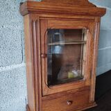 Old glass wall shelf with drawer door