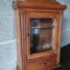 Old glass wall shelf with drawer door